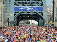 a photo of the Great North Run in action with thousands of runners