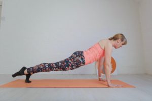 Leg Pull Prone pilates exercise being performed on a pilates mat.