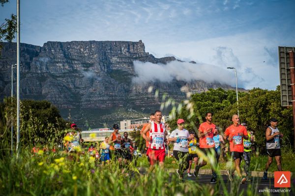 Marathon runners with Table Mountain in the background