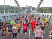 Runners on the bridge between Wales and Anglesey