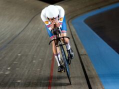 A male cyclists rides on the new black track bicycle