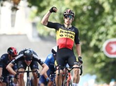 Wout van Aert holds his right arm aloft as he wins the opening stage of the 2021 Tour of Britain.