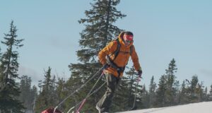 Man pulls sled on ice