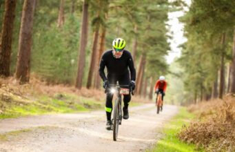 Two male cyclists in a cycling race in a forest