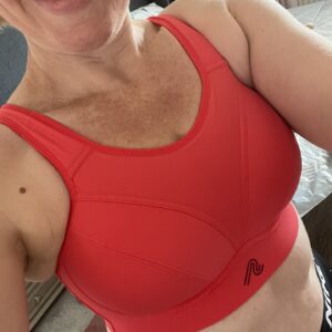 Close up of woman wearing red sports bra