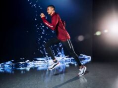 Male runner 'runs' in a black studio with what appears to be water behind him