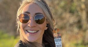 Young female runners holds maple coffee gel