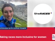 A female runner in a blue jacket smiles at the camera. Graphic also shows SheRACES logo and the words Interview with Sophie Power: Making races more inclusive for women.