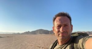 Man in desert takes a selfie