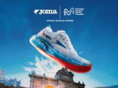Running shoe against a blue sky backdrop of Madrid