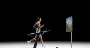 Woman runs on a treadmill with a large screen in front of her