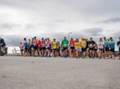 Runners line up on a start line