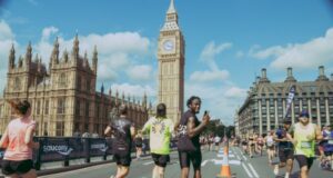 Runners on road in London with Elizabeth Tower in background