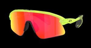 Pair of sunglasses with pink lenses and yellow frames