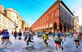 Runners run across an Italian square