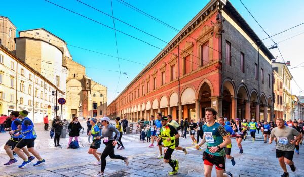 Runners run across an Italian square