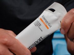 Puresport launches new energy gel for runners Closeup of hands holding an energy gel in a white packet