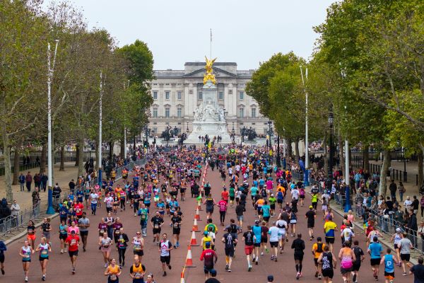 Royal Parks Half Marathon Runners inn a race on the mall in front of Buckingham Palace