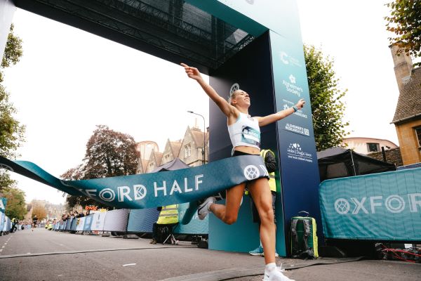 Oxford Half Marathon female winner 2025 Female runner breaks through finish tape