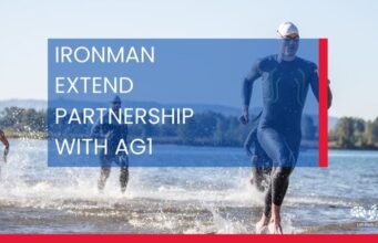 Image of triathletes running out of water. Words read: Ironman extend partnership with AG1