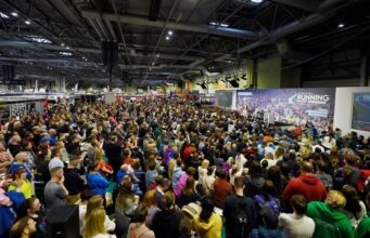 More stars revealed for National Running Show A crowd of people sit in front of the National Running Show stage