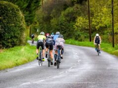 A group of cyclists on a country road
