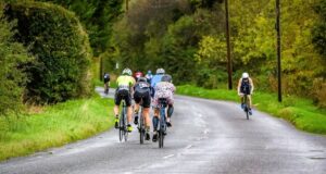 A group of cyclists on a country road