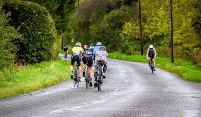 A group of cyclists on a country road
