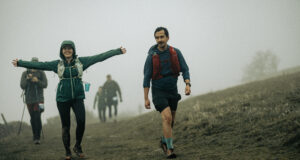 Runners walking on a claggy hill