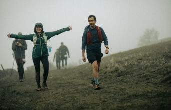 Runners walking on a claggy hill