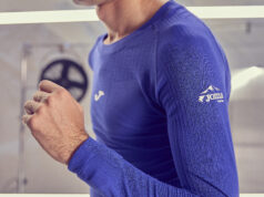 Close up of man wearing purple long sleeve technical running top