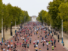 Ballot opens for Royal Parks Half Marathon Runners running along The Mall with Buckingham Palace in the distance