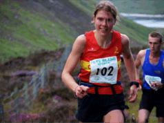 Jasmin Paris MBE named Brathay Trust Patron A woman in a red club vest and a race number runs uphill