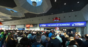 Runners queue to enter an exhibition hall