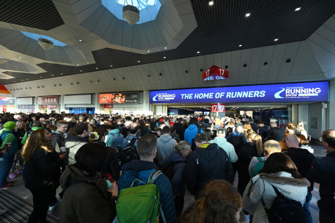 Runners queue to enter an exhibition hall