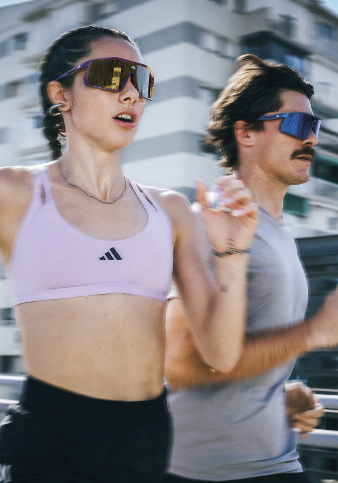 adidas Two runners, a female and male, wear running sunglasses