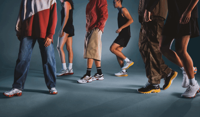 Lower bodies of people wearing different running shoes, some runners, some casually dressed