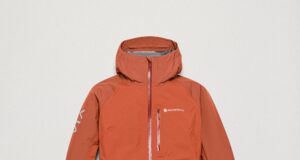 An orange hooded waterproof jacket on a white background