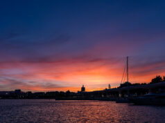 A sunset over a Spanish coastal town