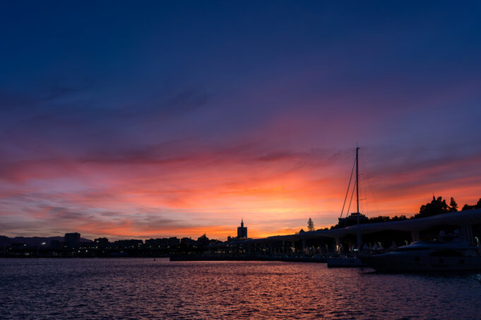 A sunset over a Spanish coastal town