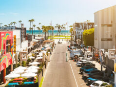 A low level LA street with the ocean in the ackground
