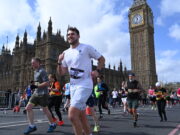 London Landmarks Ballot is now open Runners on a busy London street next to Elizabeth Tower and the Houses of Parliament