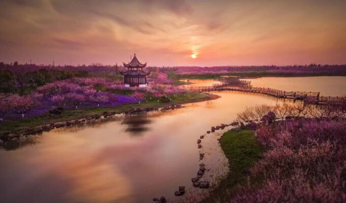 Challenge Family launches Challenge Shanghai An ethereal riverside landscape with a Chinese Temple