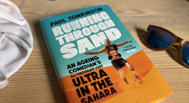 Running Through Sand: we can still do hard things Book and sunglasses on a wooden table