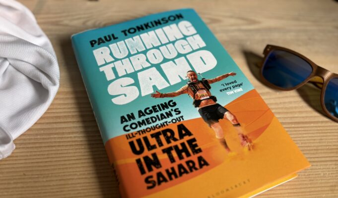 Running Through Sand: we can still do hard things Book and sunglasses on a wooden table