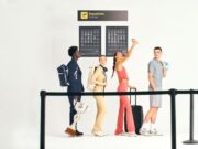 Joma’s Resort lifestyle collection two young men and two young women are dressed in different casual wear outfits. They look as though they're in a queue at an airport as have backpacks and luggage with them.