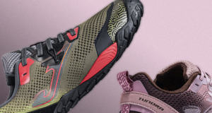Two barefoot trainers are shown on a lilac background. One is a lilac colour, one is a green and red colour.