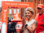 Kevin Sinfield and Kelly Holmes to start Great Manchester Run Short haired woman next to large bell.