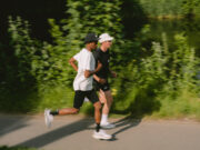 Two men running in black and white