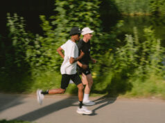 Two men running in black and white